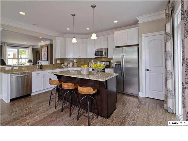 2068 Avinity Loop Charlottesville, VA 22902 - Photo 6 of 16 a kitchen with stainless steel appliances granite countertop a refrigerator a sink dishwasher a dining table and chairs with wooden floor