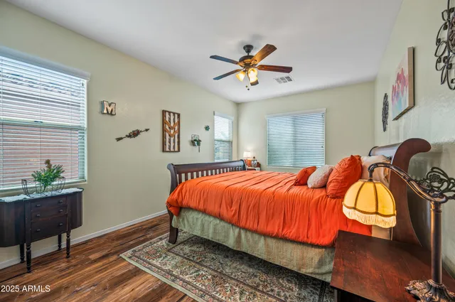 a bed room with a bed and a chandelier