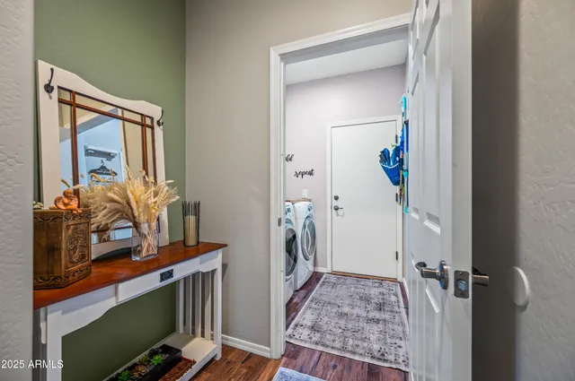 a view of an entryway with wooden floor