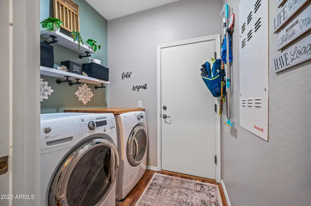 a view of storage and utility room with washer and dryer