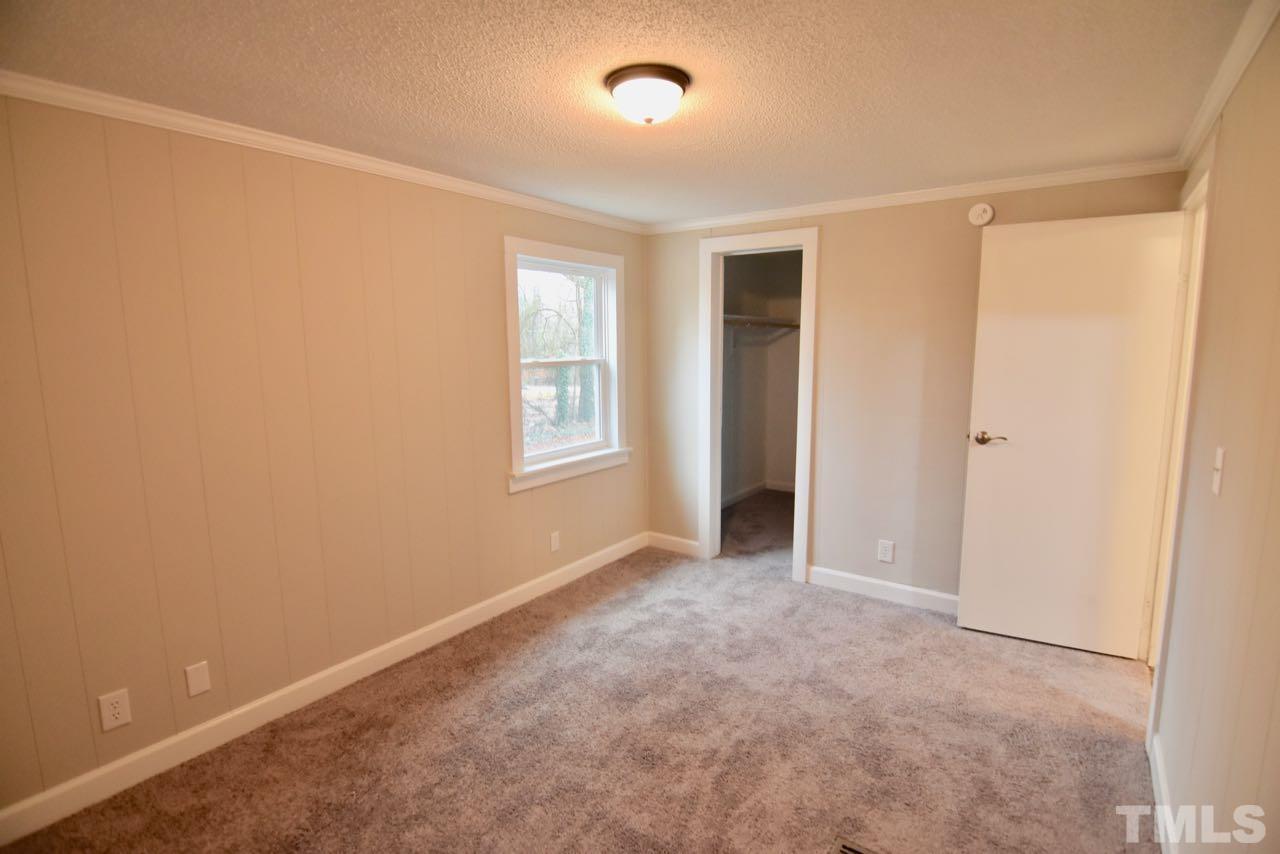 10110 Timothy Road Dunn, NC 28334 - Photo 38 of 41 an empty room with windows and closet
