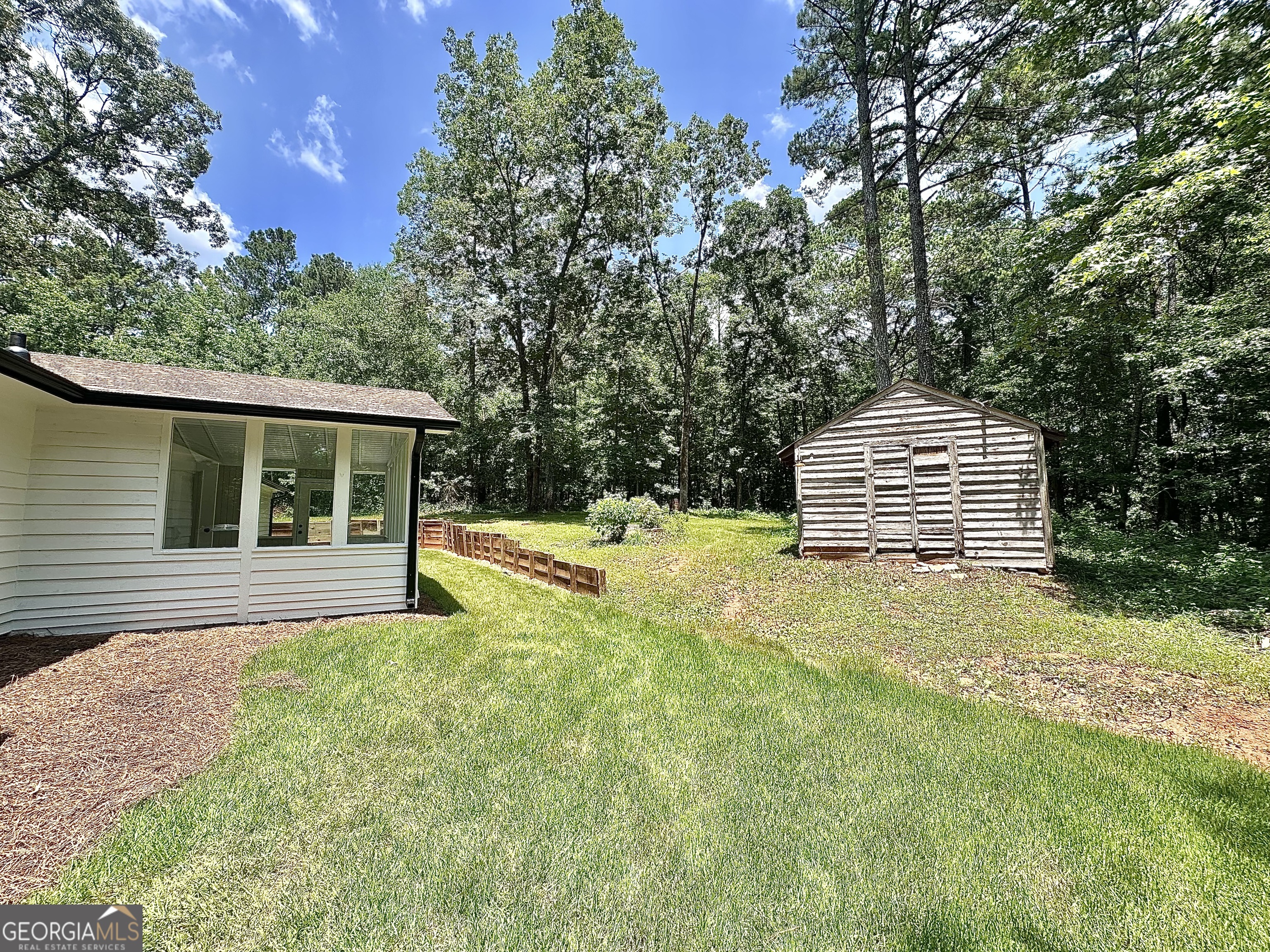 115 Creekside Lane Covington, GA 30016 - Photo 12 of 59 a front view of a house with a yard