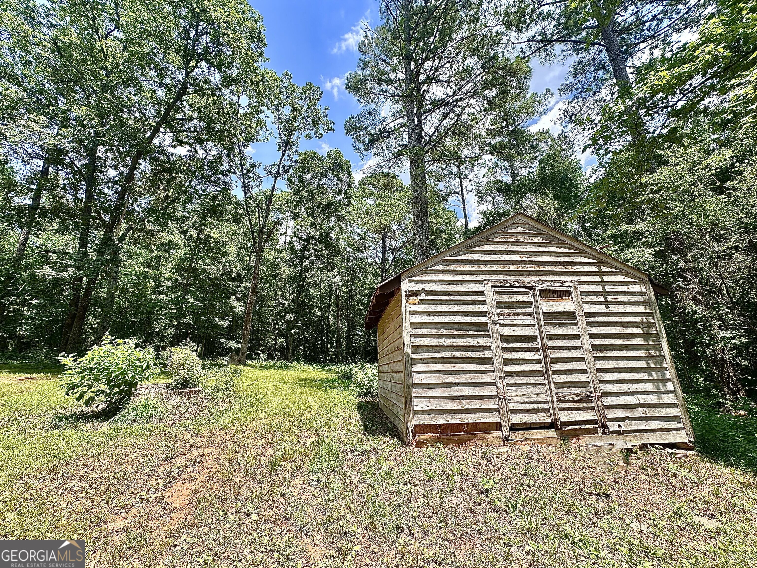 115 Creekside Lane Covington, GA 30016 - Photo 16 of 59 a view of a house with a yard