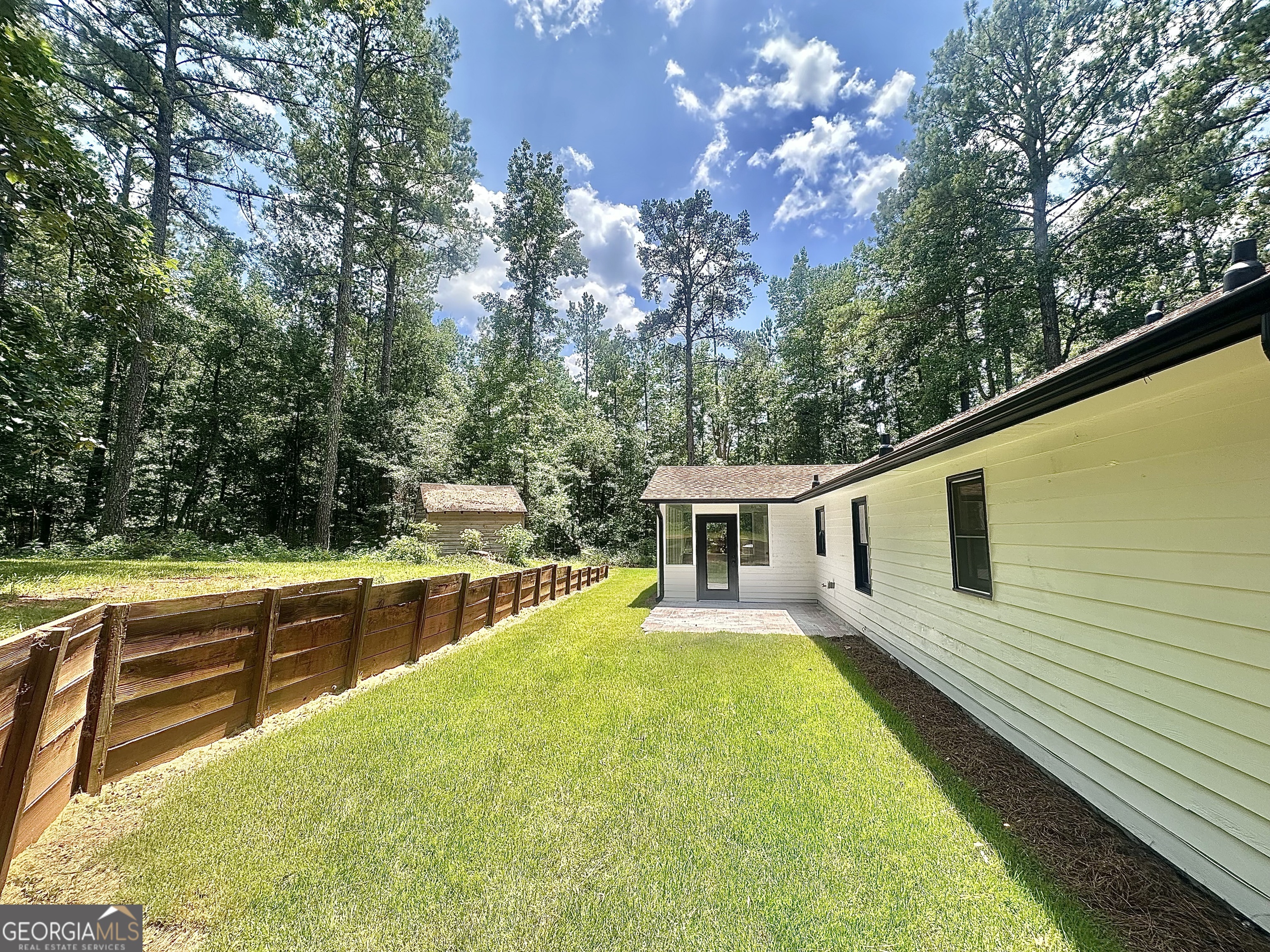 115 Creekside Lane Covington, GA 30016 - Photo 18 of 59 a view of a house with pool and chairs