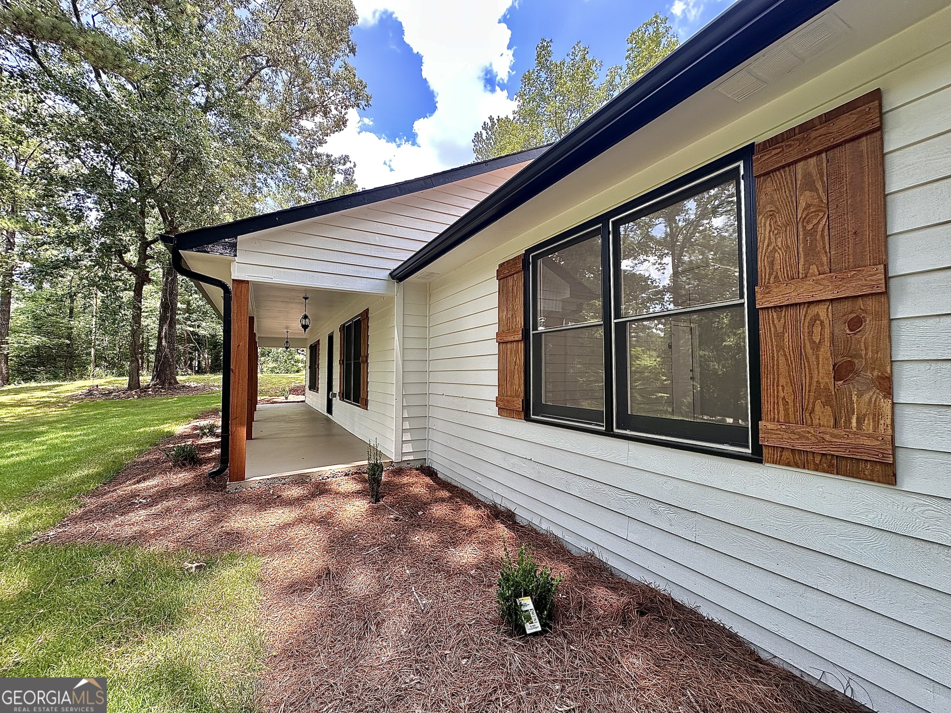 115 Creekside Lane Covington, GA 30016 - Photo 23 of 59 a view of a house with backyard and a area