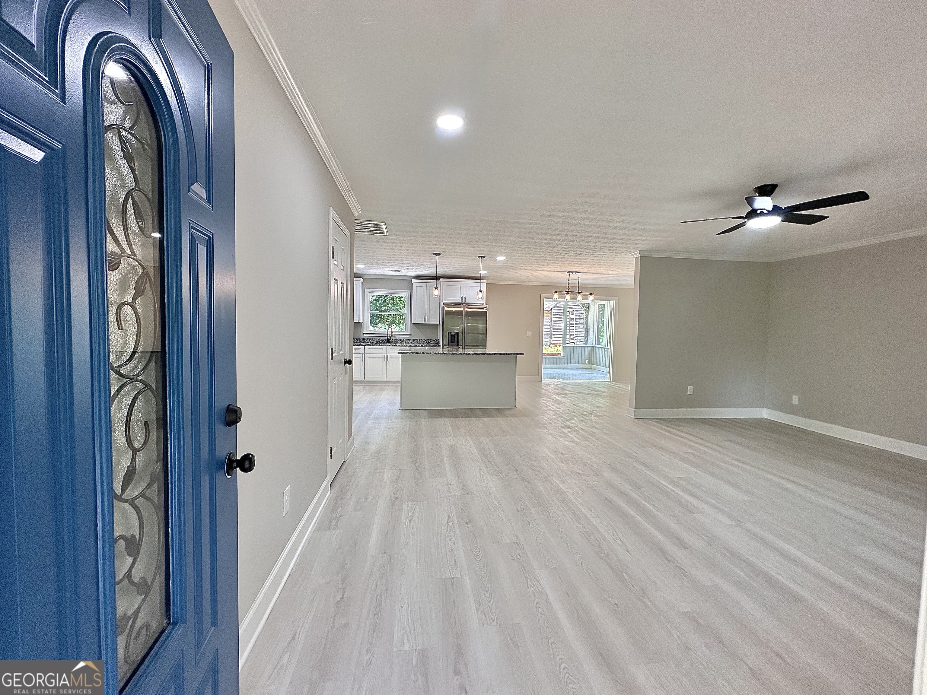 115 Creekside Lane Covington, GA 30016 - Photo 27 of 59 a view of a hallway with wooden floor and staircase