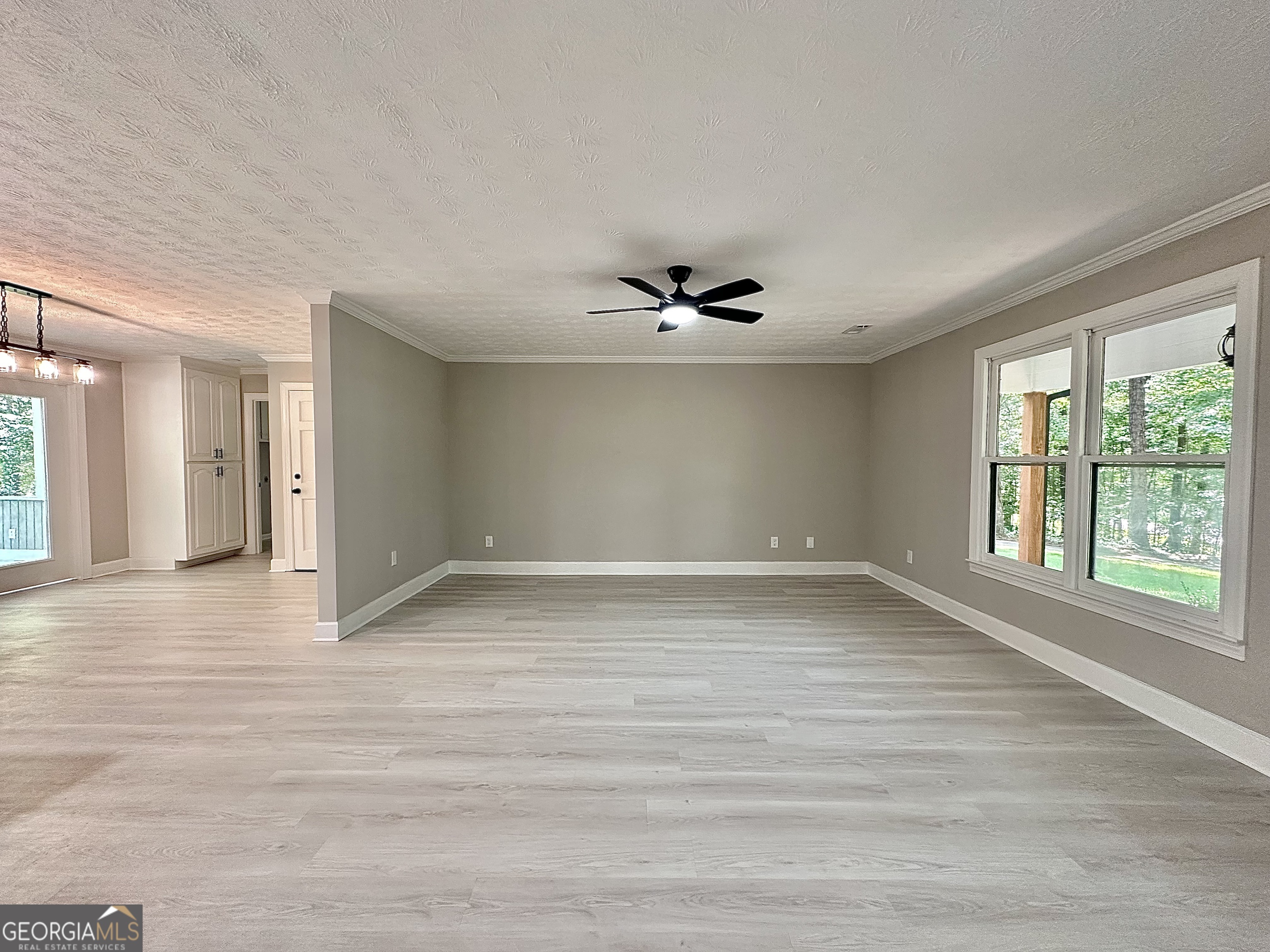 115 Creekside Lane Covington, GA 30016 - Photo 30 of 59 a view of an empty room with a window