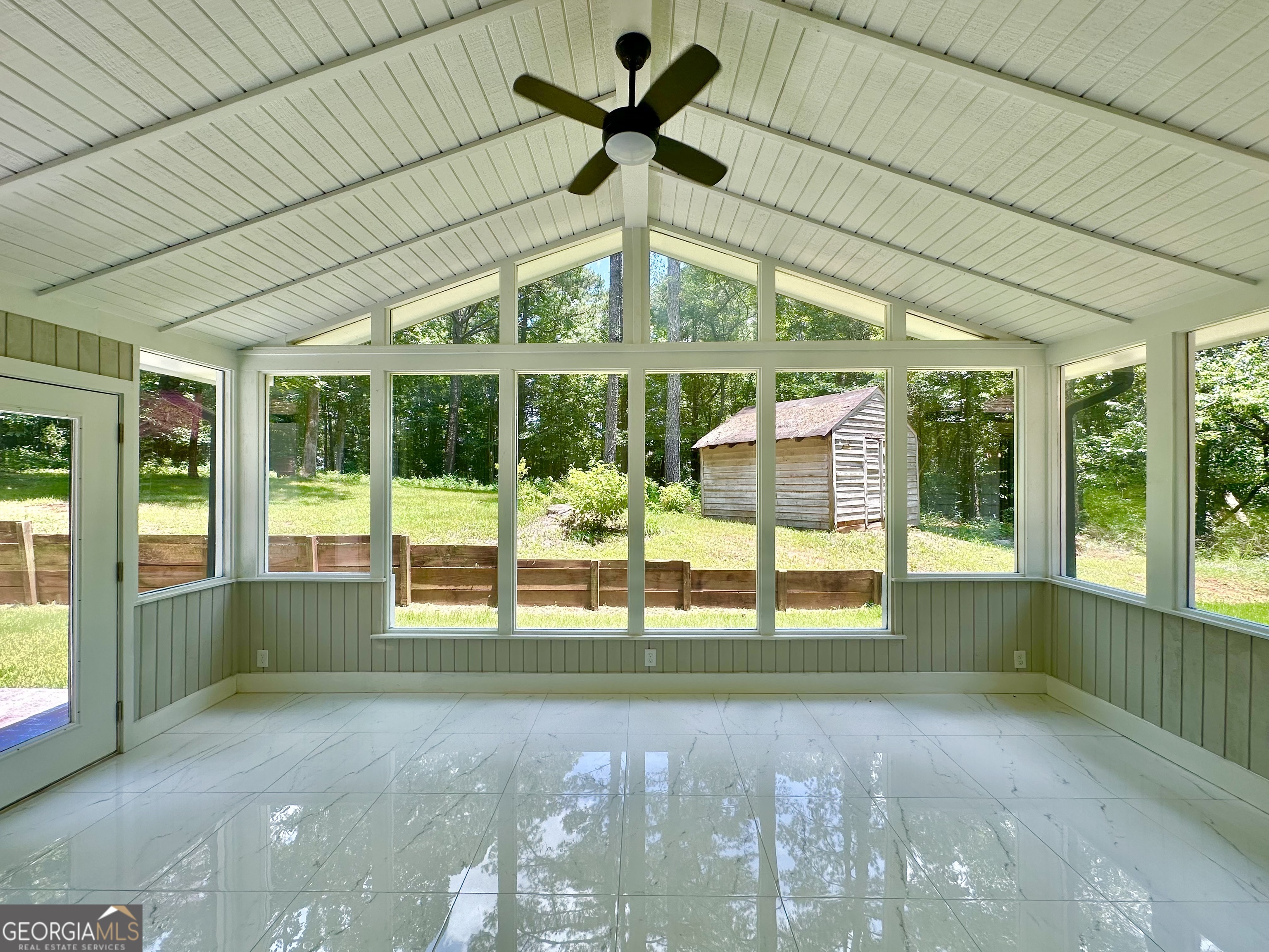 115 Creekside Lane Covington, GA 30016 - Photo 44 of 59 a view of a house with porch and a backyard