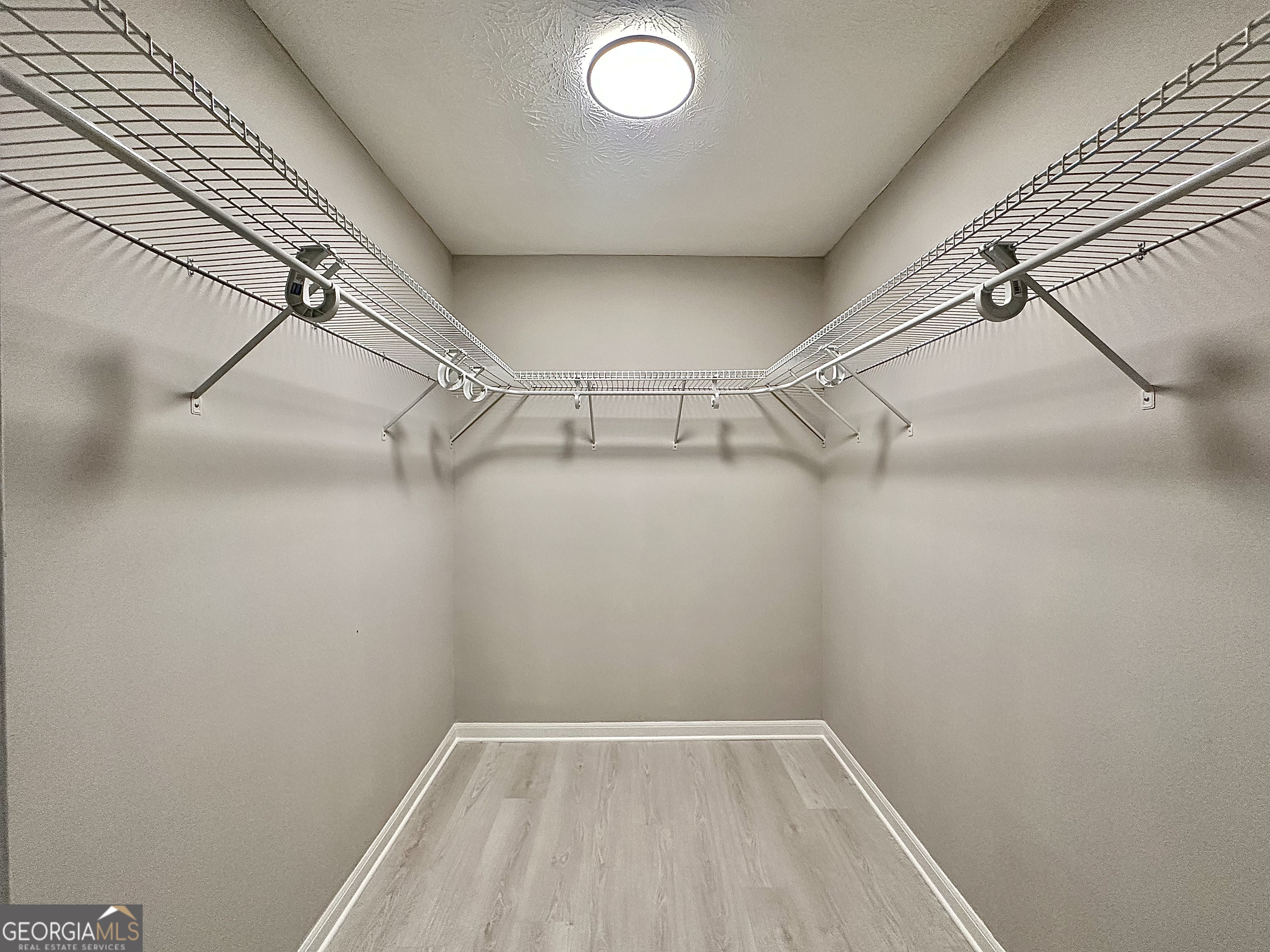 115 Creekside Lane Covington, GA 30016 - Photo 54 of 59 a view of a room with racks on the wall