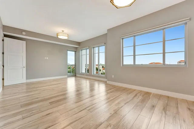 a bathroom with a double vanity sink toilet mirror and bathtub