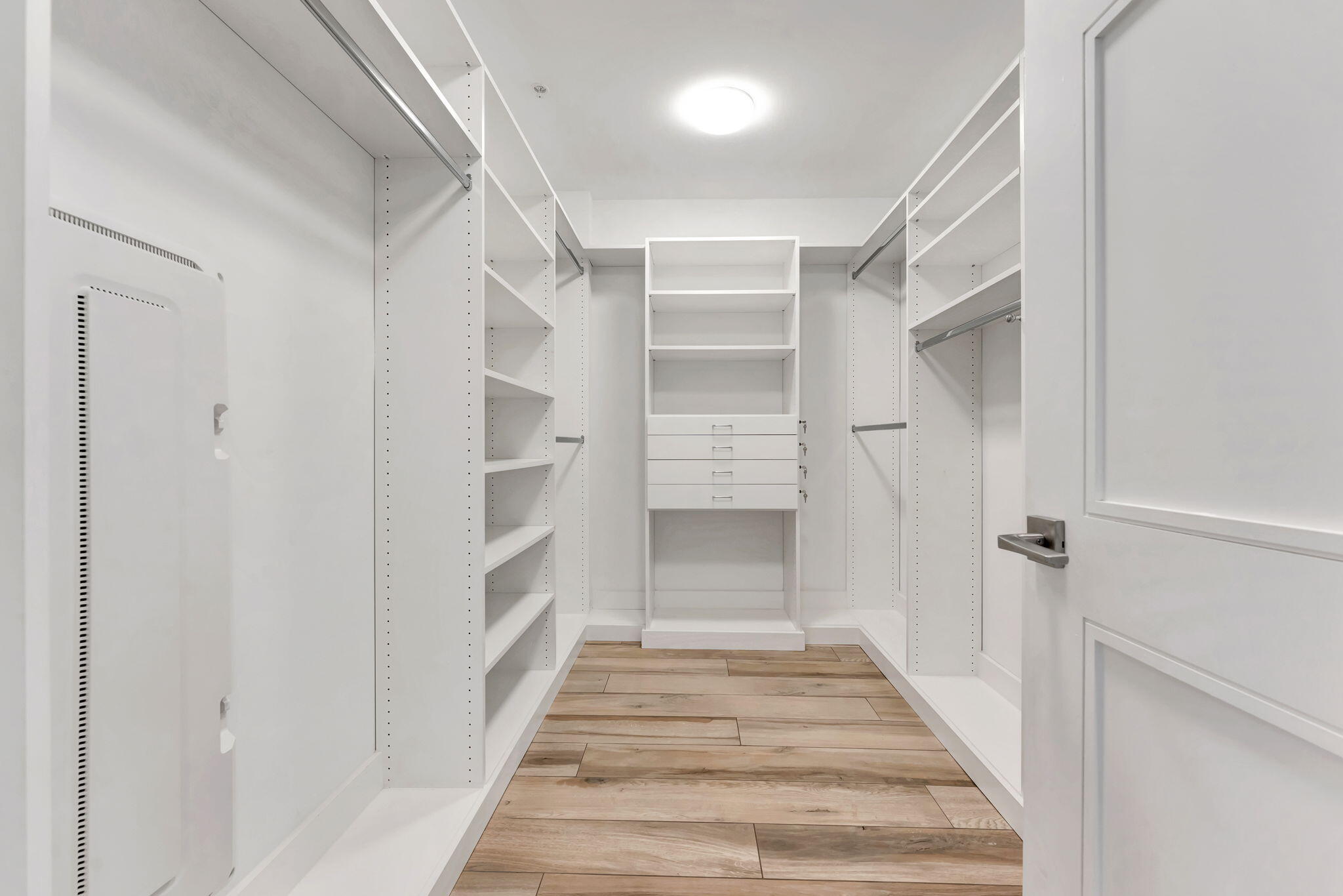 155 East Boca Raton Road, Unit 719 Boca Raton, FL 33432 - Photo 32 of 102 a view of a hallway with closet and wooden floor