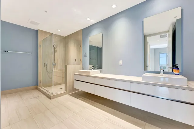 a living room with furniture a chandelier and a rug