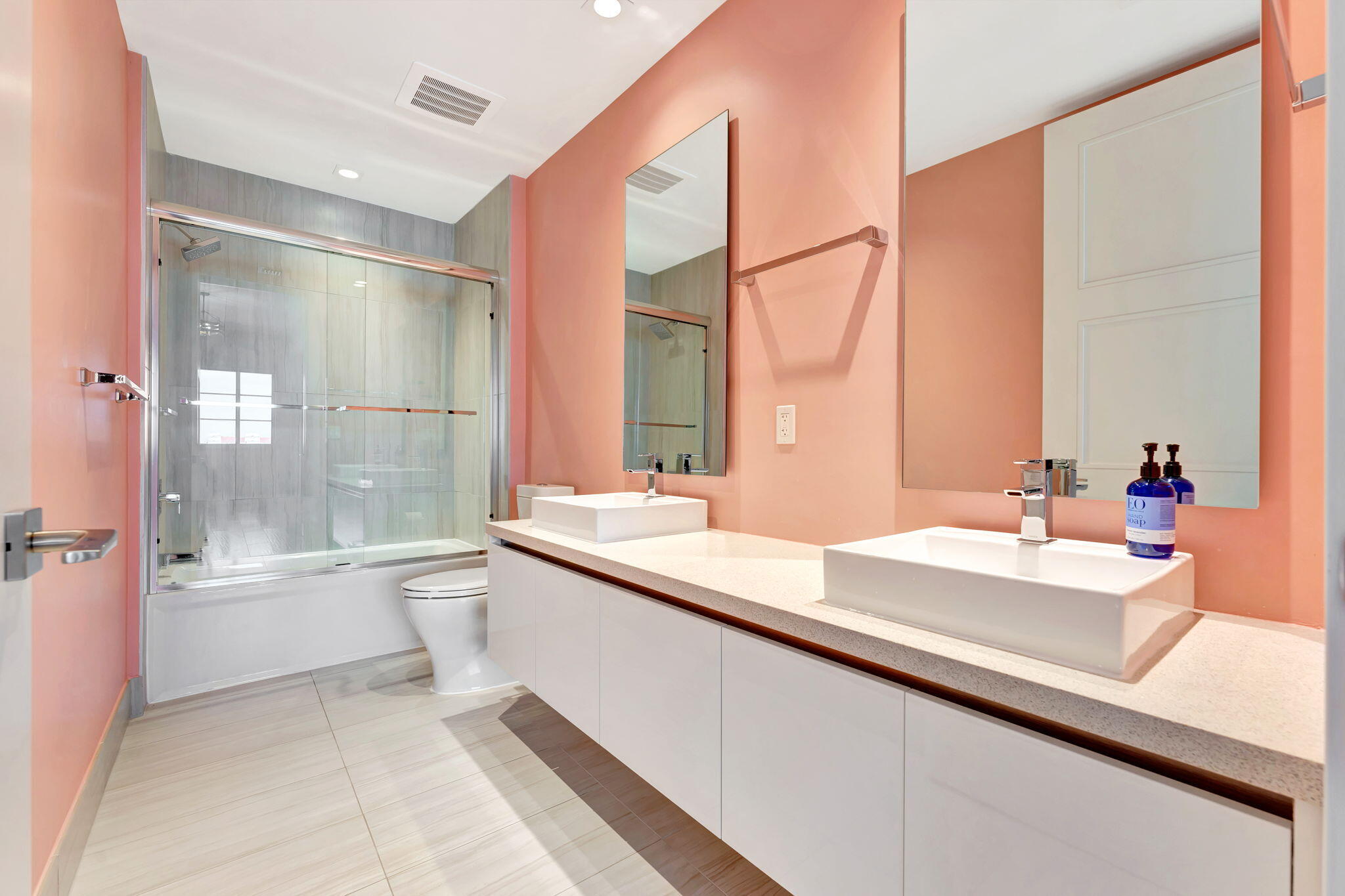 155 East Boca Raton Road, Unit 719 Boca Raton, FL 33432 - Photo 41 of 102 a bathroom with a double vanity sink toilet mirror and bathtub