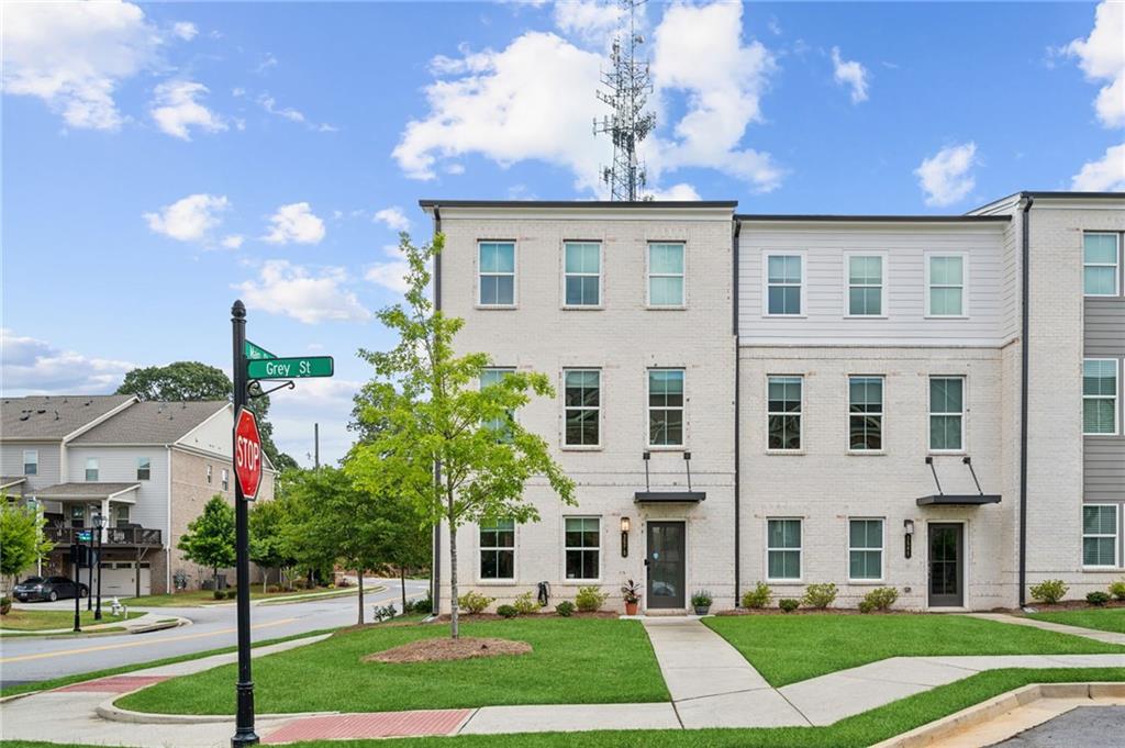 a front view of a house with a yard