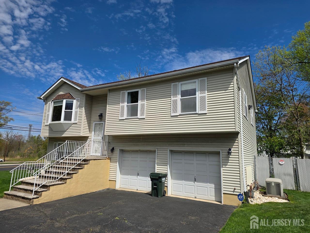 1 Wakefield Drive Edison, NJ 08820 - Photo 3 of 29 a front view of a house with garage