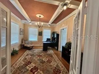 a lobby with furniture and a chandelier