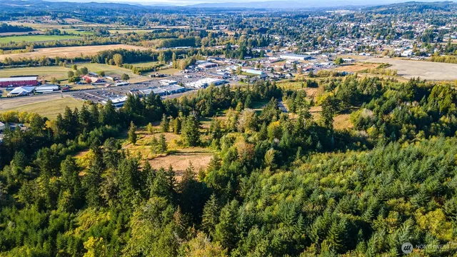 a view of a pathway with a wrought fence