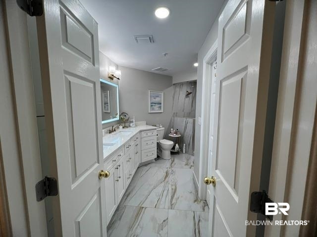 27580 Canal Road, Unit 1210 Orange Beach, AL 36561 - Photo 15 of 28 Bathroom featuring a marble finish shower, light marble finish flooring, vanity, and recessed lighting