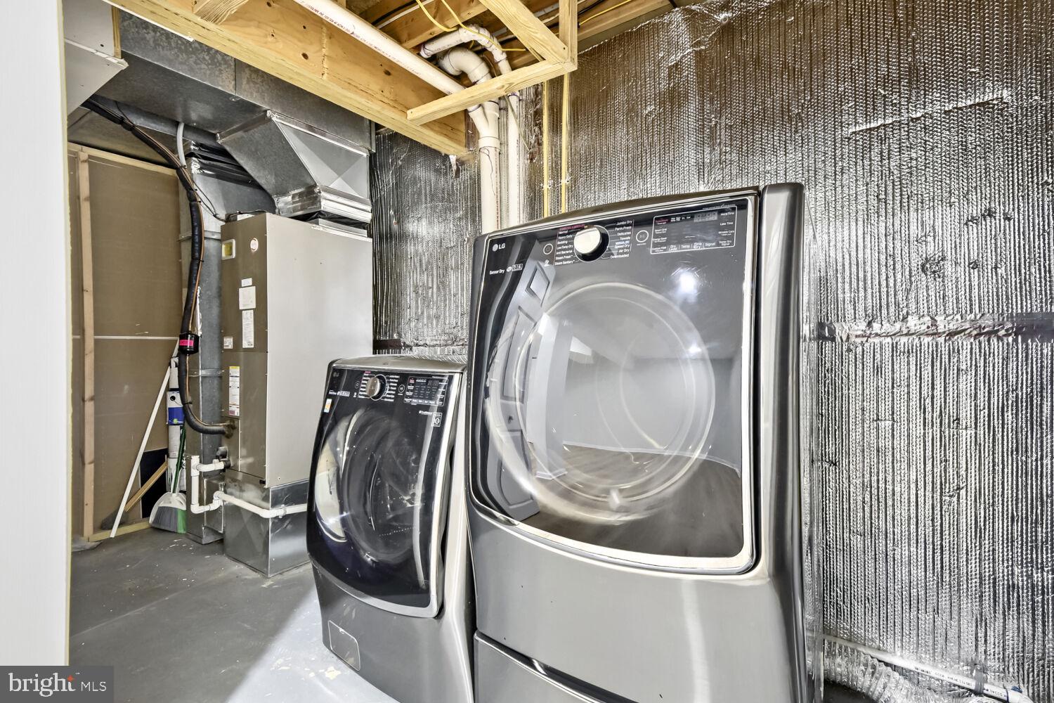 7202 Rutherford Green Circle Baltimore, MD 21244 - Photo 25 of 29 Modern laundry space with sleek appliances.