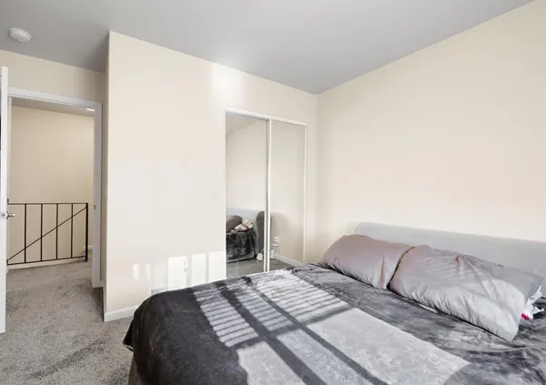 a bedroom with a bed and a cabinets