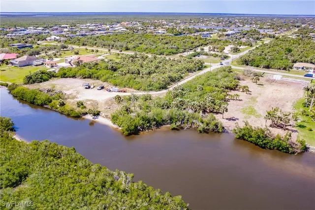 an aerial view of a houses with a street