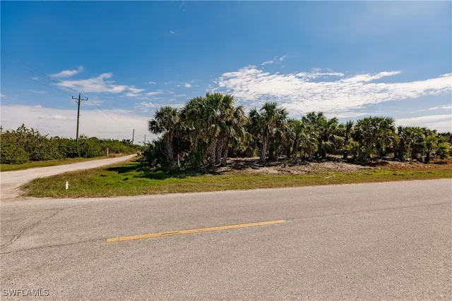 a view of swimming pool is middle in the middle of a yard