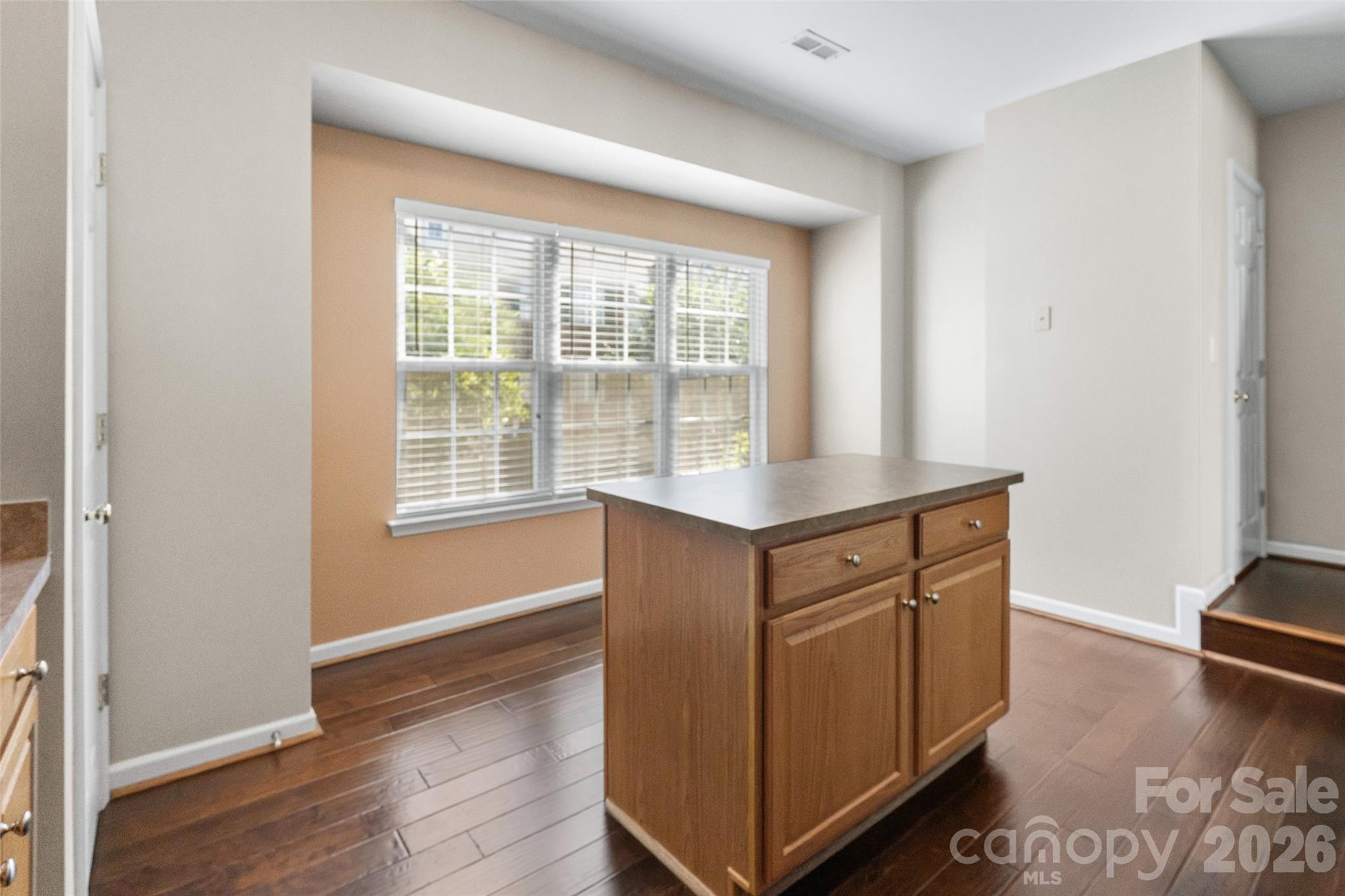 104 Rock Ridge Lane Mount Holly, NC 28120 - Photo 22 of 48 a view of kitchen with wooden floor and electronic appliances