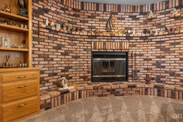 a living room with furniture ceiling fan and a flat screen tv