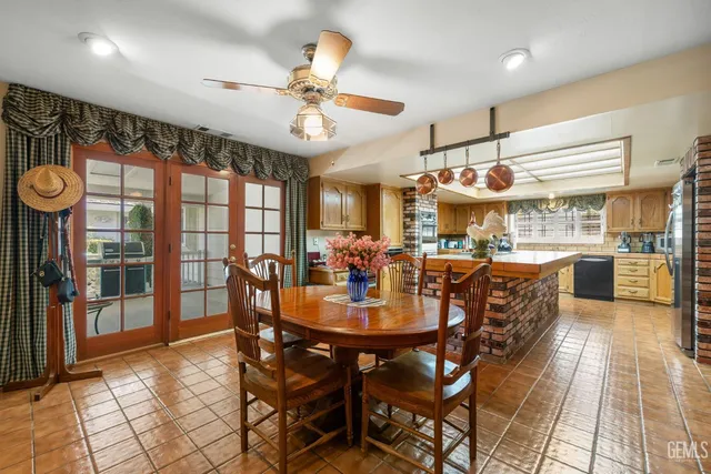 a kitchen with stainless steel appliances granite countertop a sink and cabinets