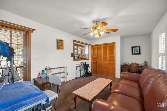 a dining room with furniture and window