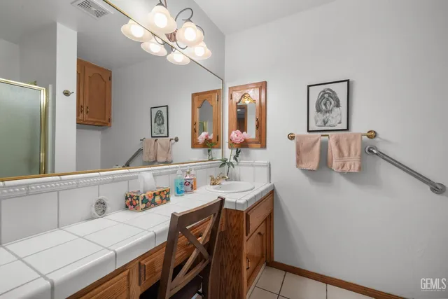 a spacious bedroom with a bed and a fireplace