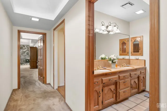 a spacious bedroom with a bed and a fireplace