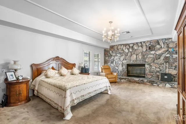 a spacious bedroom with bed and windows