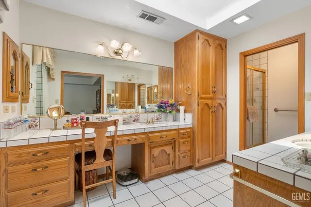 a bathroom with a sink a double vanity and a mirror
