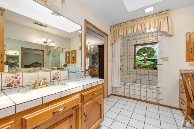 a bedroom with furniture and a book shelf