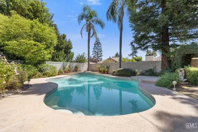 a view of a swimming pool with a patio