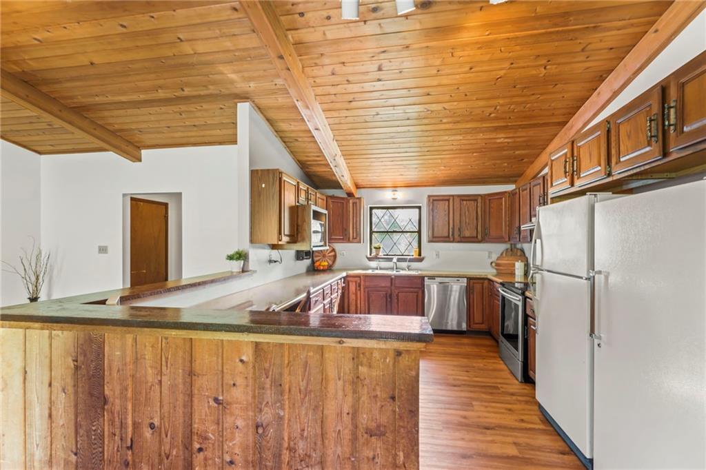 738 Beagle Club Road McDonald, PA 15057 - Photo 12 of 47 Turn around and your greeted with this rustic charmer of a kitchen. Also, PLENTY of counterspace with these newer countertops (2016). You even have a breakfast nook so the kids can eat their cereal and you can have your morning coffee before you start your day!
