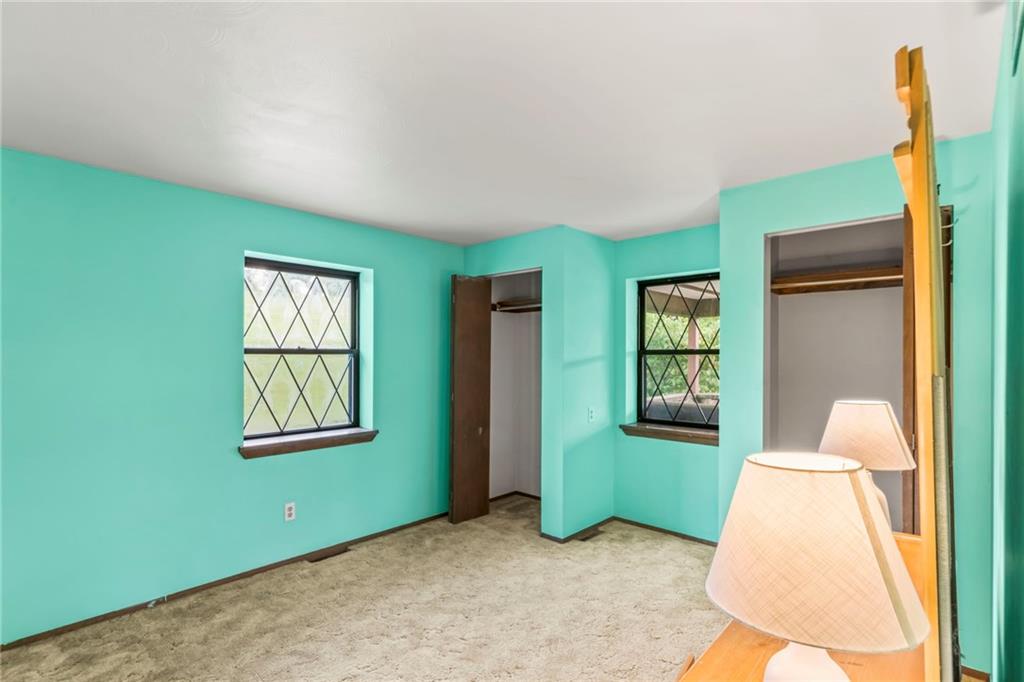 738 Beagle Club Road McDonald, PA 15057 - Photo 24 of 47 Across the way from bedroom 2 is bedroom 3. This room has double closets as well and the window looks out onto the covered patio.