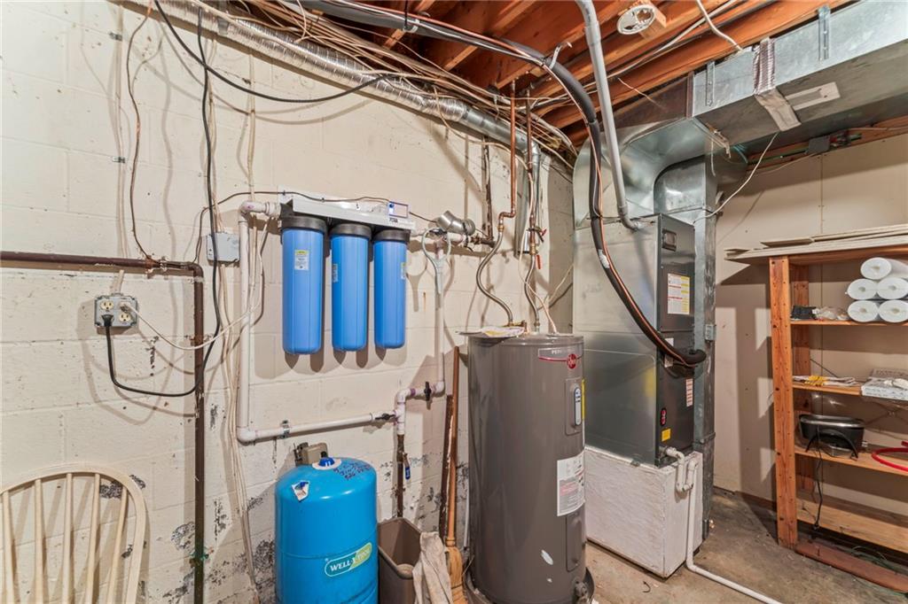 738 Beagle Club Road McDonald, PA 15057 - Photo 33 of 47 Step inside the utility room and you'll find 1. ton's more storage 2. brand new furnance and a/c 4. newer hot water tank (2016) 3. water filtration system