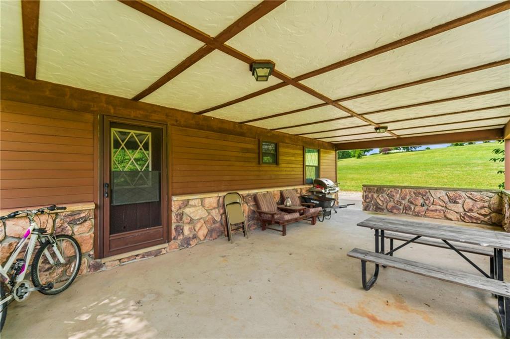 738 Beagle Club Road McDonald, PA 15057 - Photo 35 of 47 THIS is the covered patio you didn't know you needed. 450 square feet of space to entertain guests or just unwind and enjoy the scenery. With upgraded exterior LED lighting, you'll be able to use this space no matter what time of day or night.