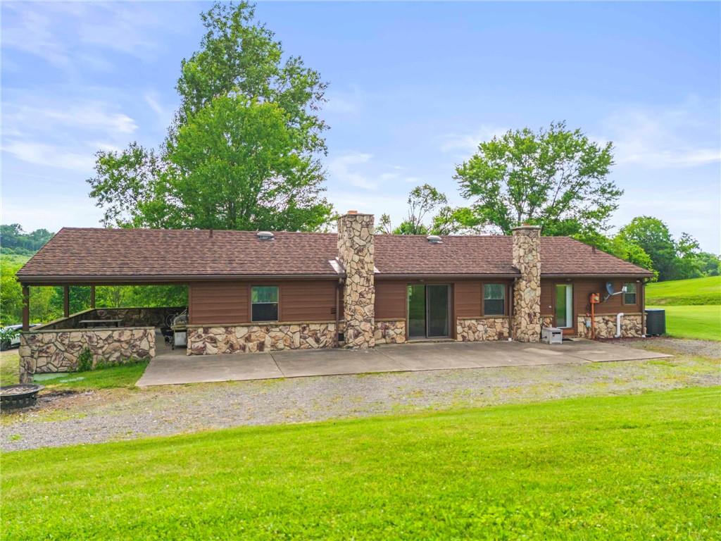 738 Beagle Club Road McDonald, PA 15057 - Photo 37 of 47 And if the covered patio isn't enough or you just need to get some sun, step around the corner to the almost twice as big uncovered patio. Like I mentioned earlier, you can step out here from the mudroom or the living room. You can even drive around here and park for an easy move in.