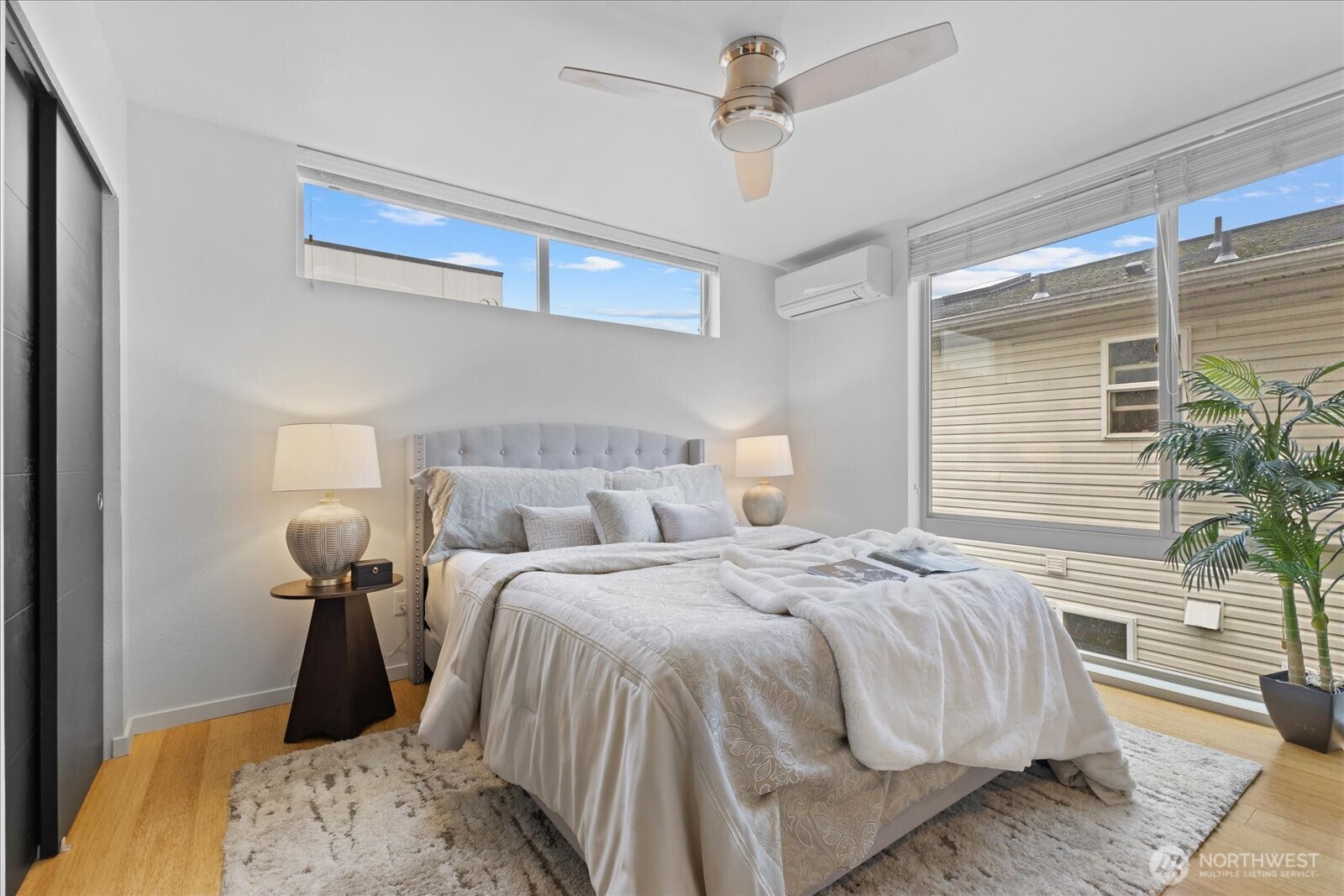 1525 Northwest 58th Street, Unit A Seattle, WA 98107 - Photo 12 of 24 a bedroom with bed and a window