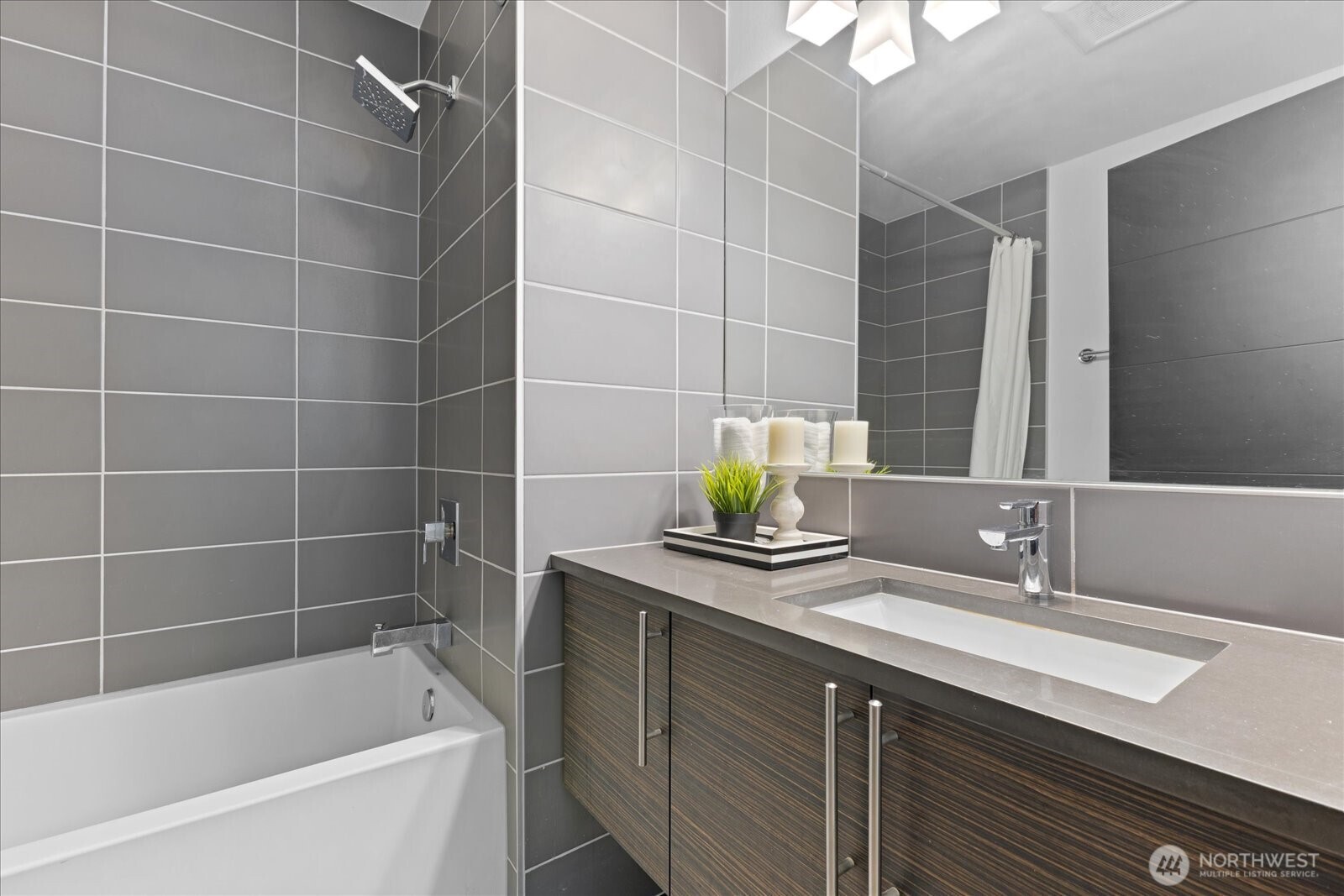 1525 Northwest 58th Street, Unit A Seattle, WA 98107 - Photo 14 of 24 a bathroom with a sink and a bathtub