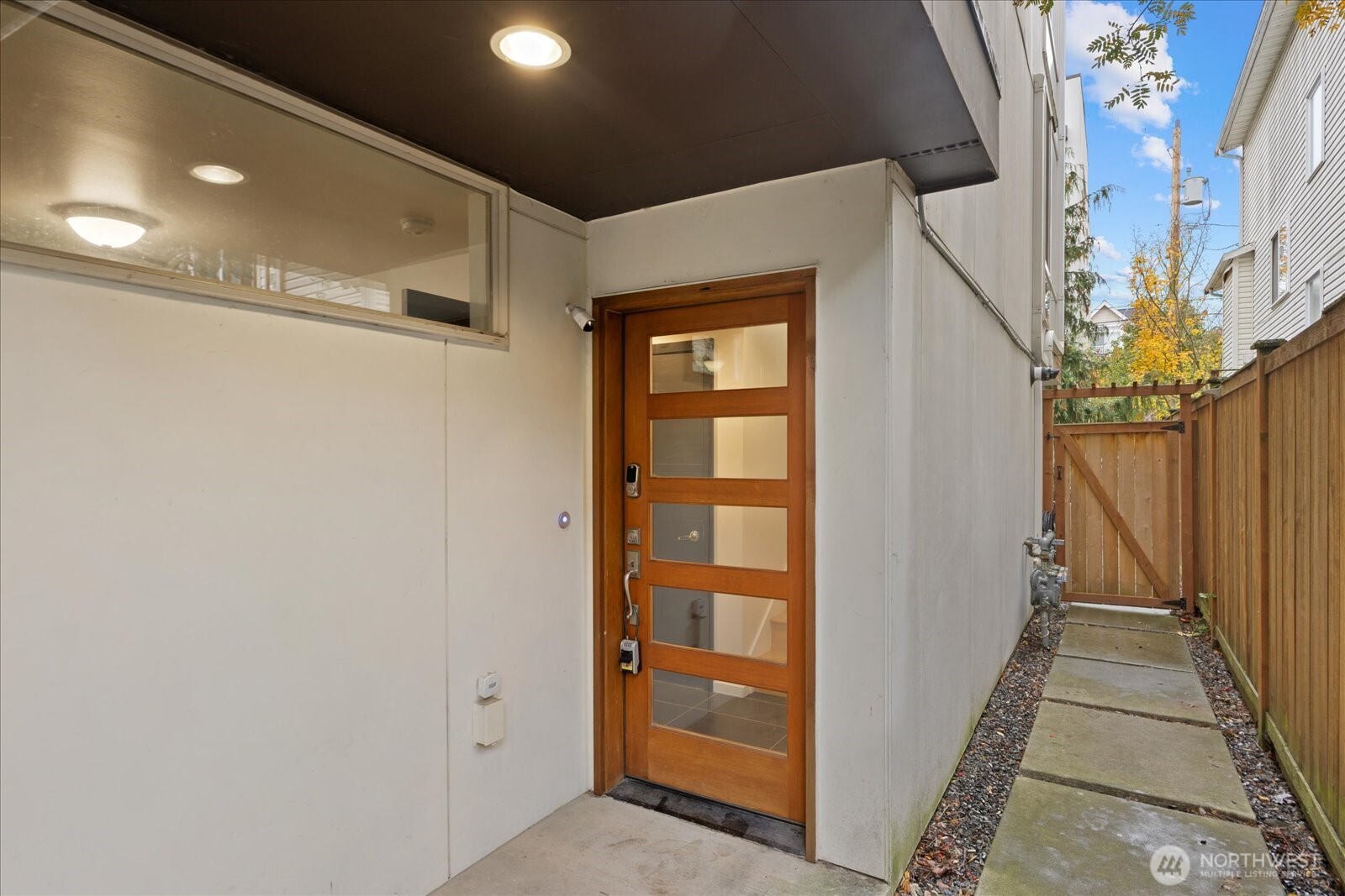 1525 Northwest 58th Street, Unit A Seattle, WA 98107 - Photo 2 of 24 a view of a hallway with wooden floor and entryway