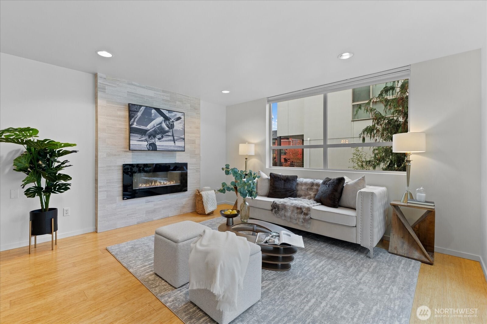1525 Northwest 58th Street, Unit A Seattle, WA 98107 - Photo 3 of 24 a living room with furniture and a fireplace