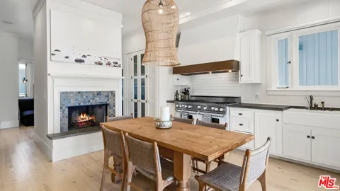 a bathroom with a sink a toilet a mirror and shower