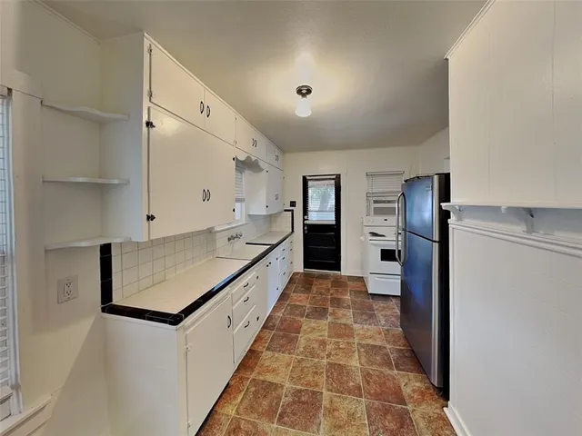 a hallway with cabinets