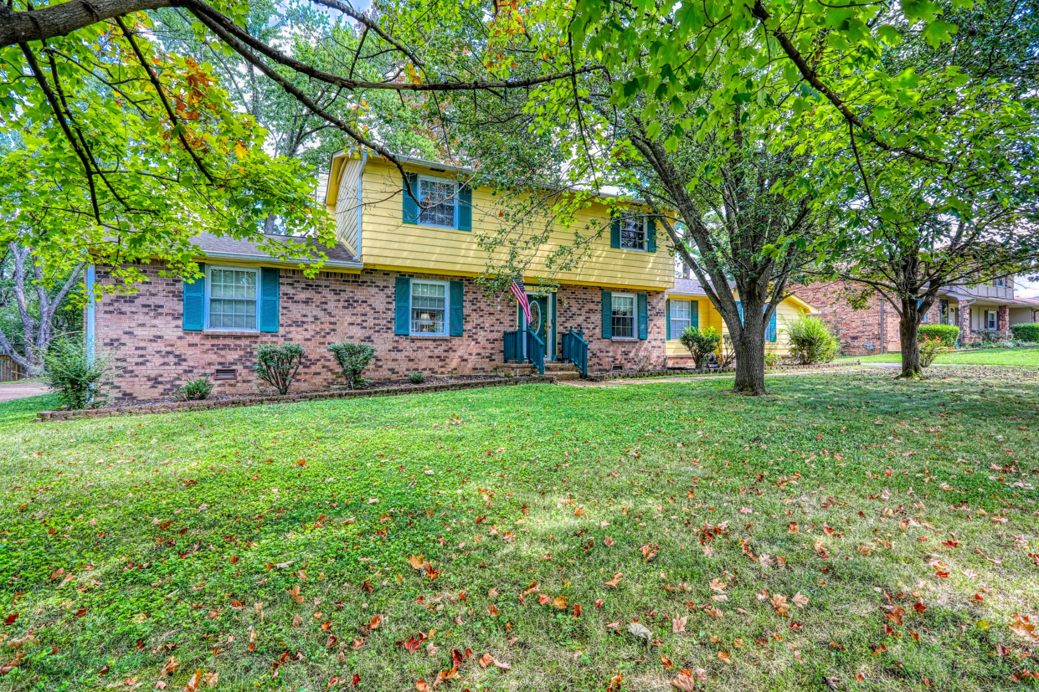 a view of a house with a yard porch and sitting area