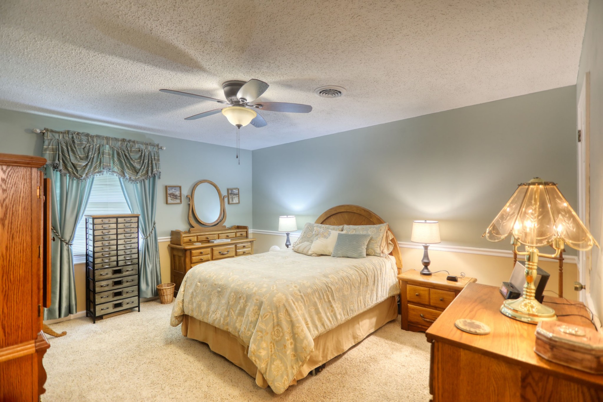 3517 Colony Point West Nashville, TN 37217 - Photo 12 of 34 a bedroom with a bed and a chandelier