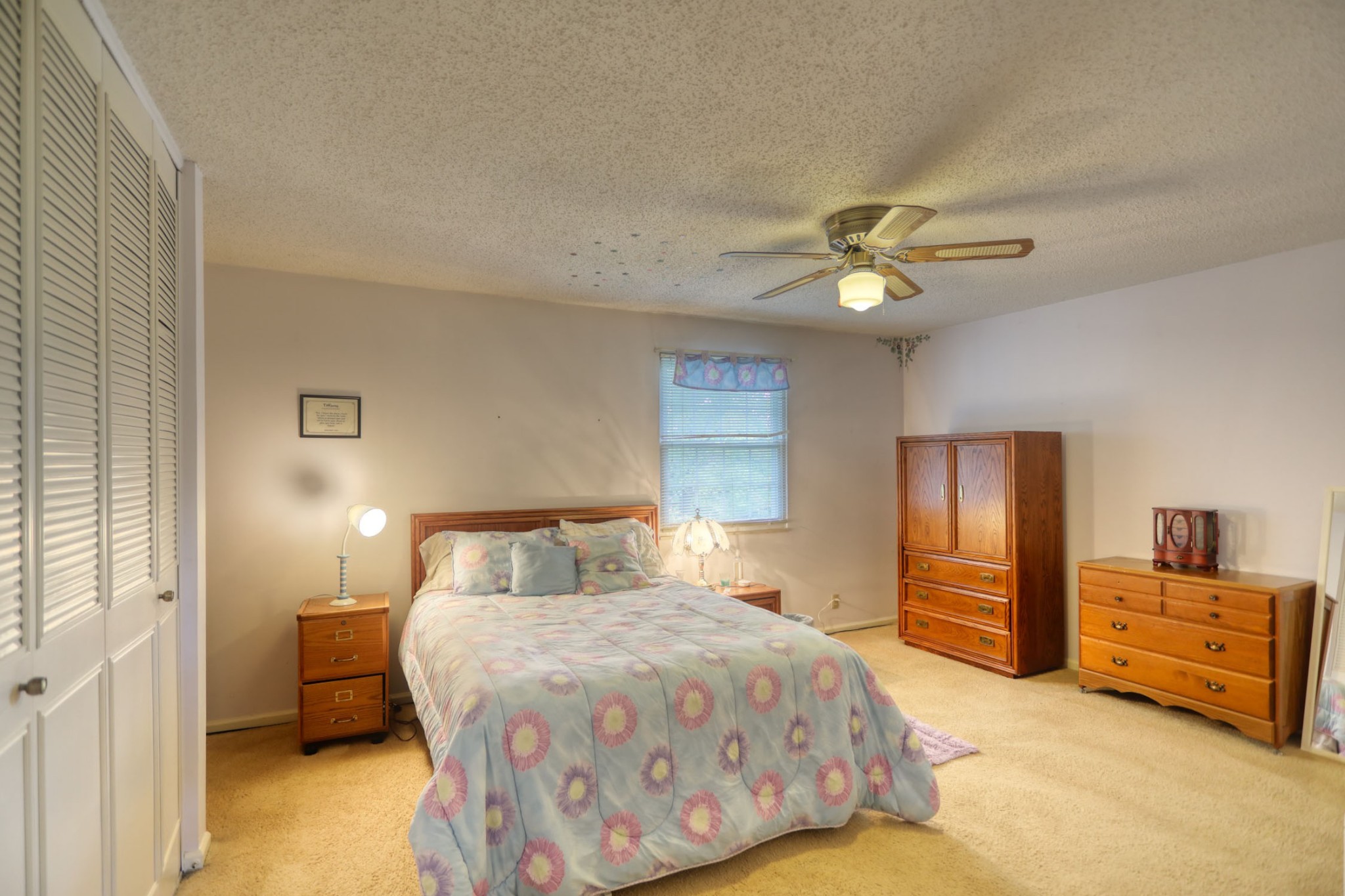 3517 Colony Point West Nashville, TN 37217 - Photo 26 of 34 a bedroom with a bed and a chandelier